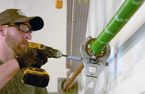 Technician Repairing Garage Door